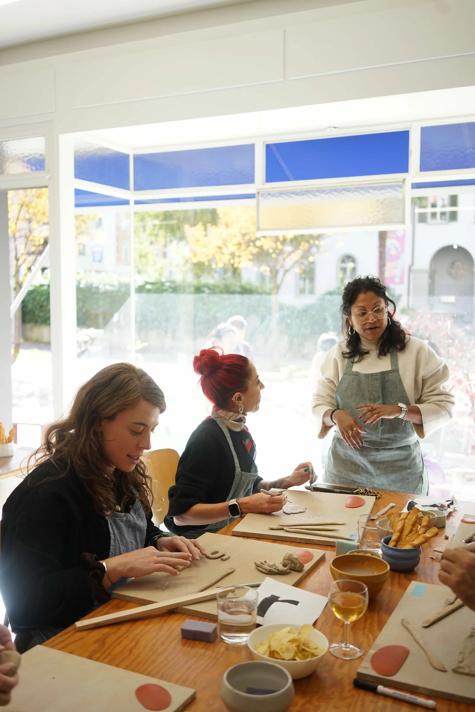 A birthday group making ceramics