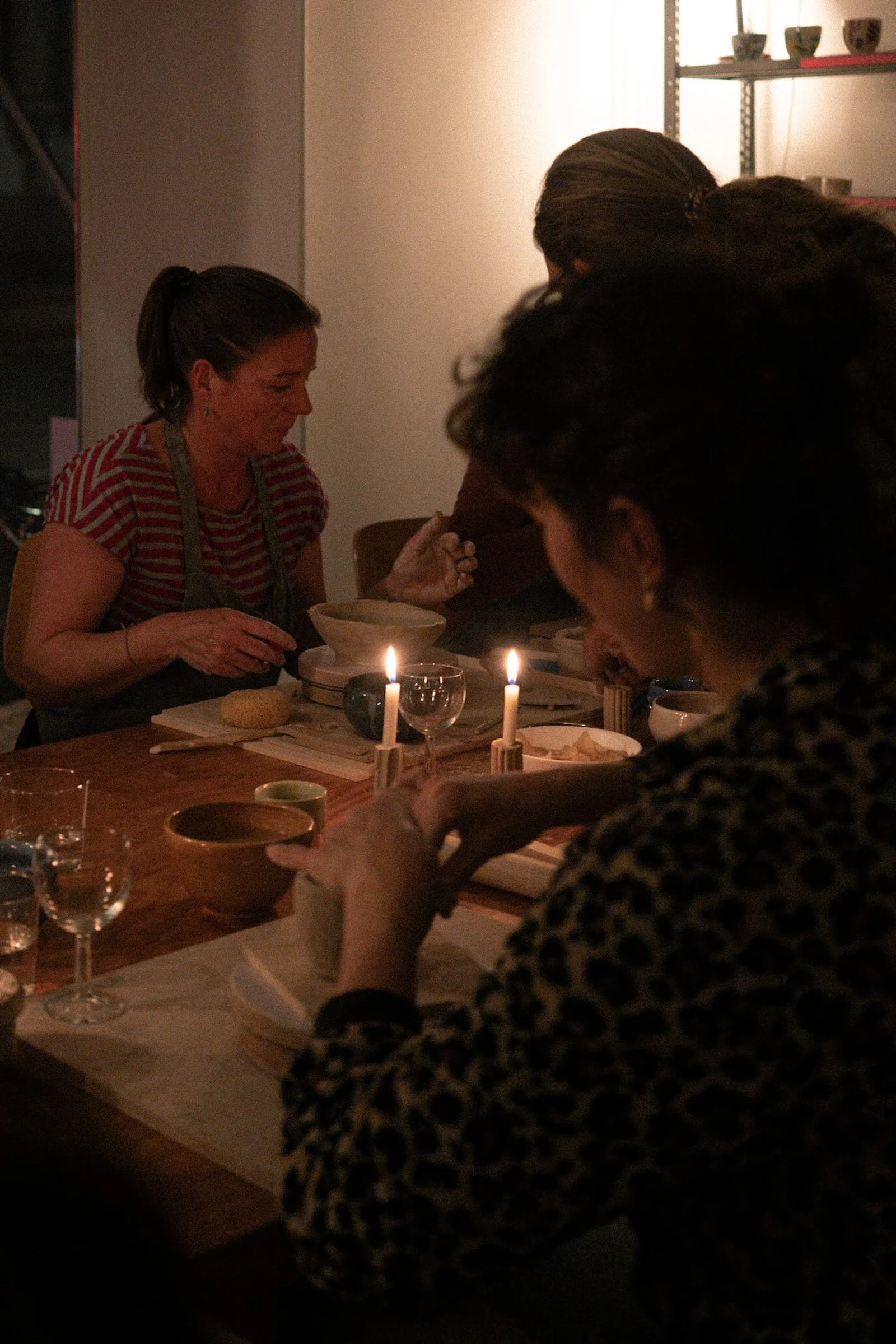 Hands shaping clay during a Friday evening class