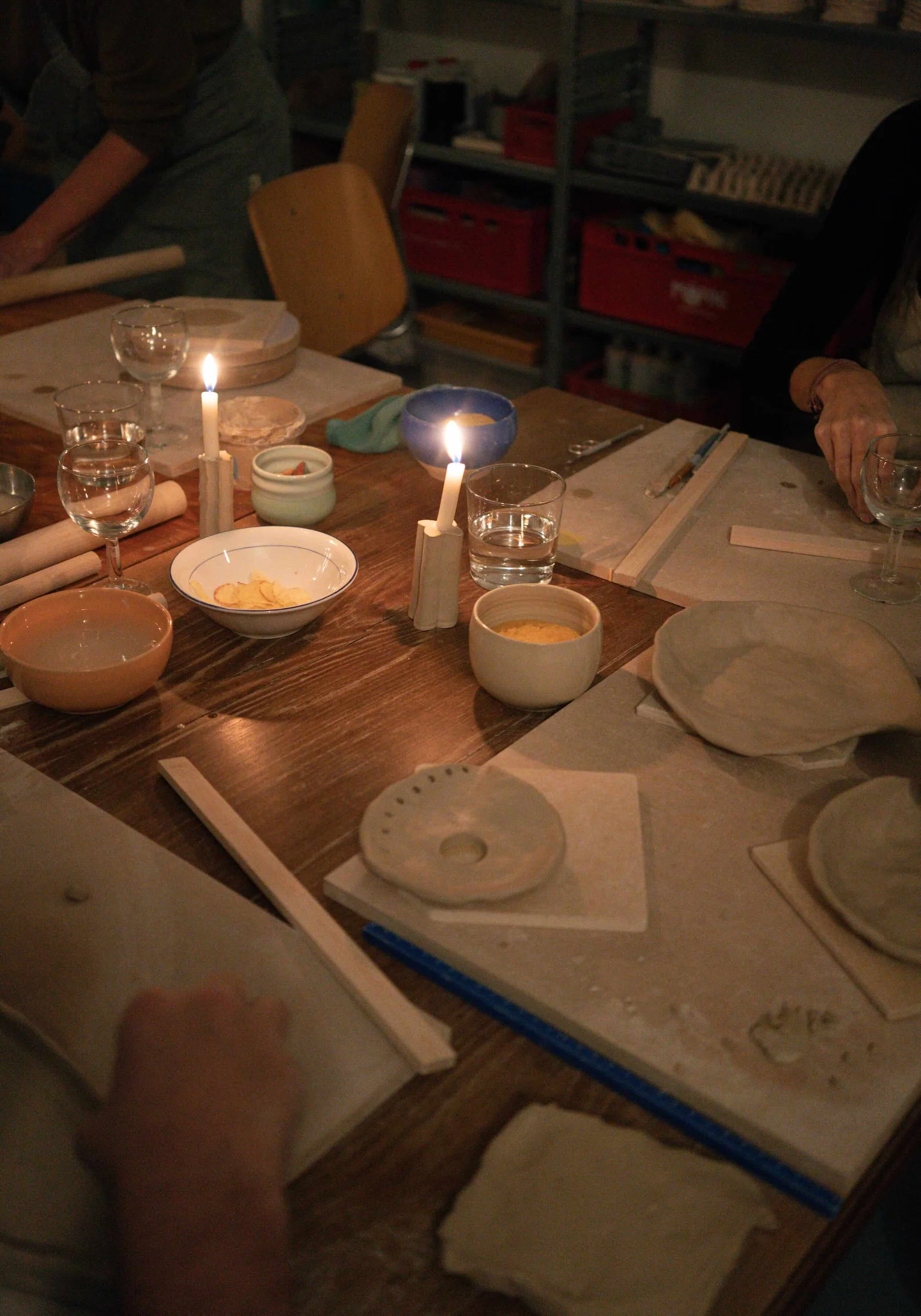 Participants throwing pots together at the studio