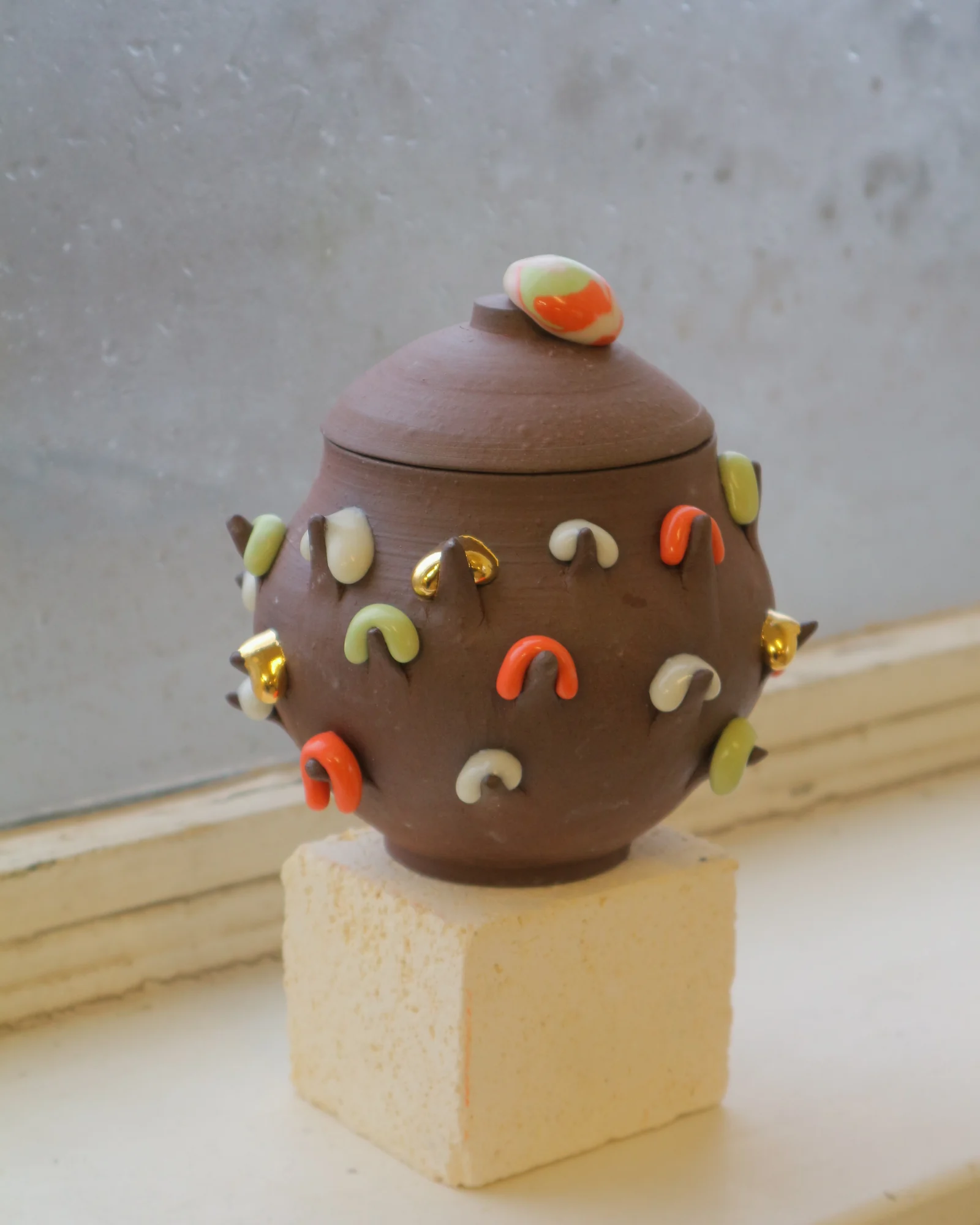 A decorated porcelain Moonjar in the studio
