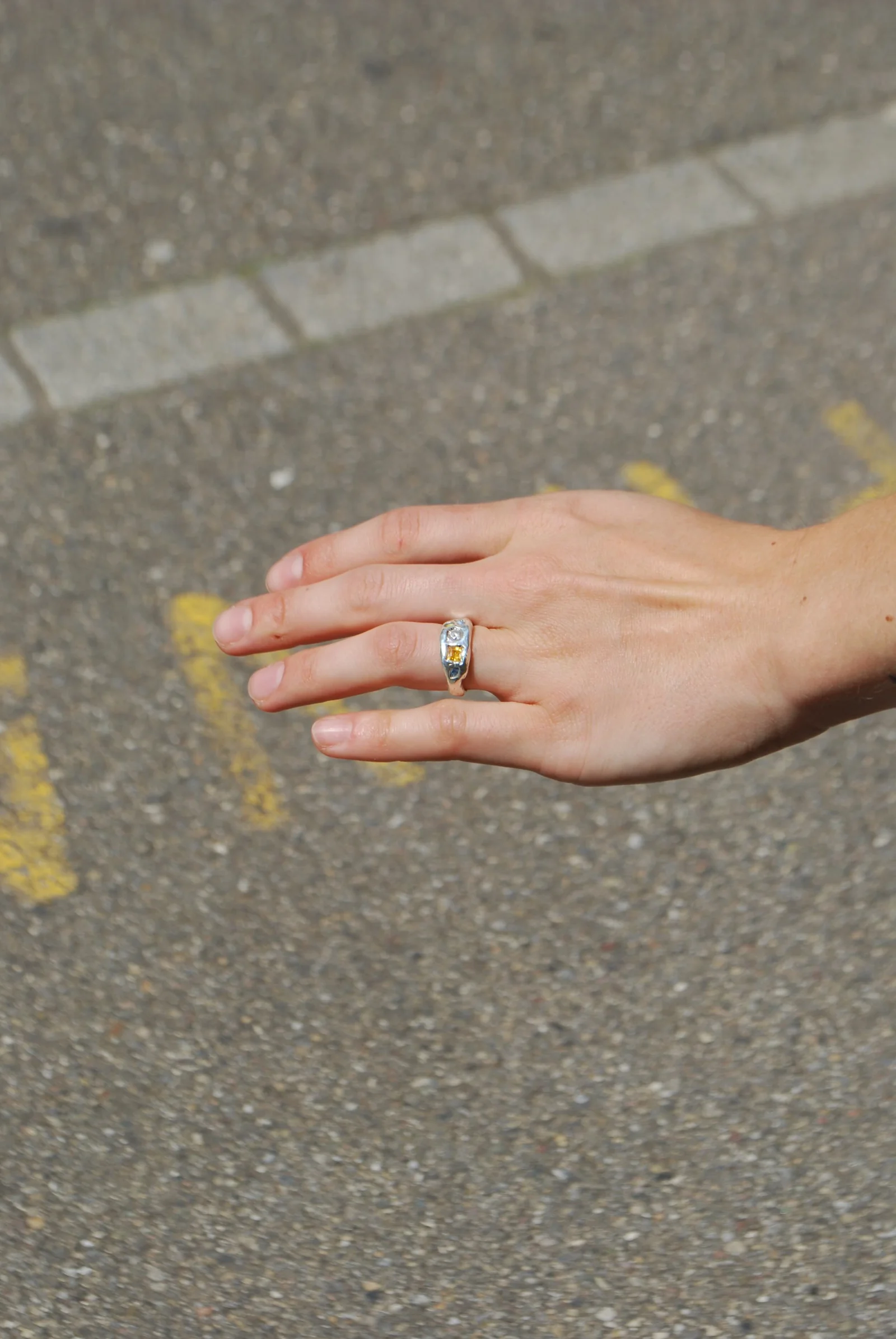 A handmade silver ring catching the light