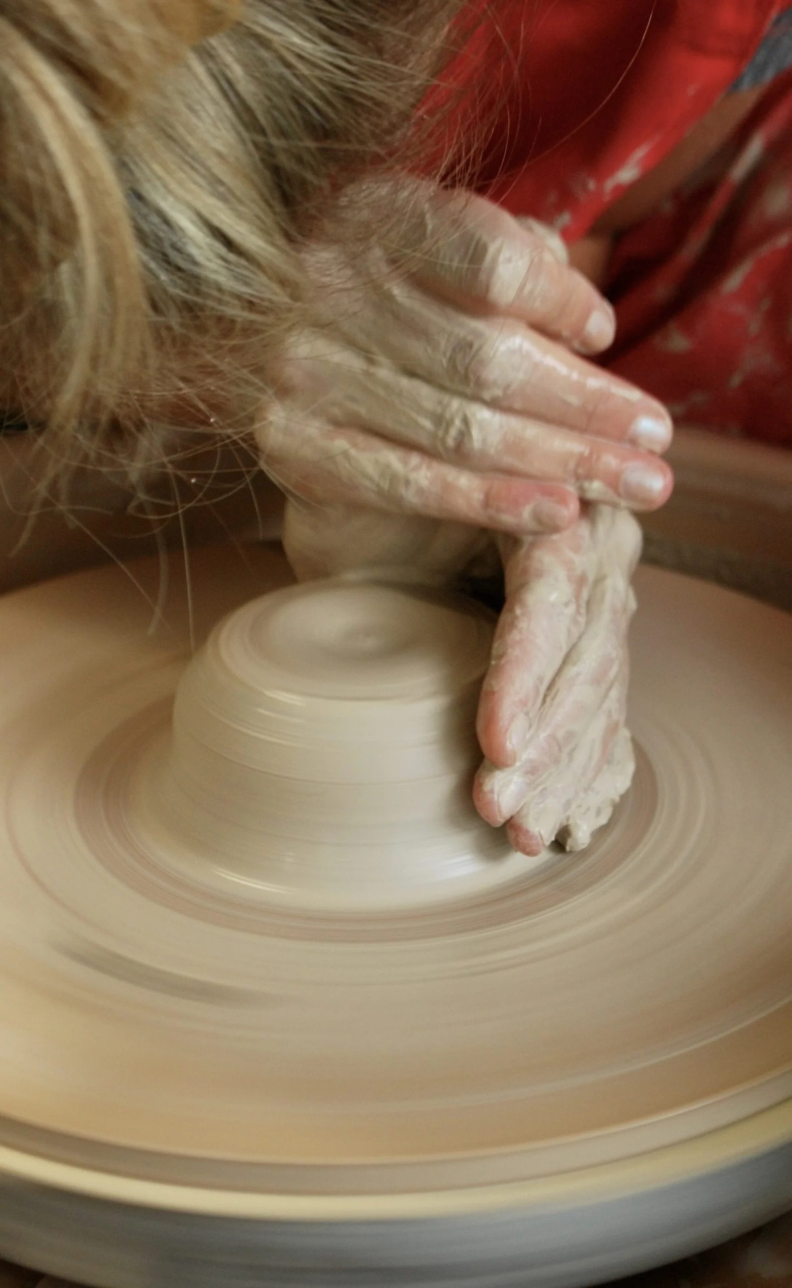 Hands pulling up the walls of a bowl